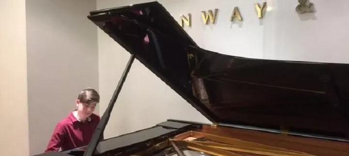 Hamish Ogilvy of Scottish boarding school Loretto, demonstrating his love of music at Steinway Hall | Dickinson School Consulting Ltd.